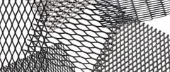 Overlapping expanded metal grating panels showing different diamond patterns