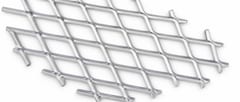 Silver galvanized expanded metal panel close-up with raised diamond strands and cut edges