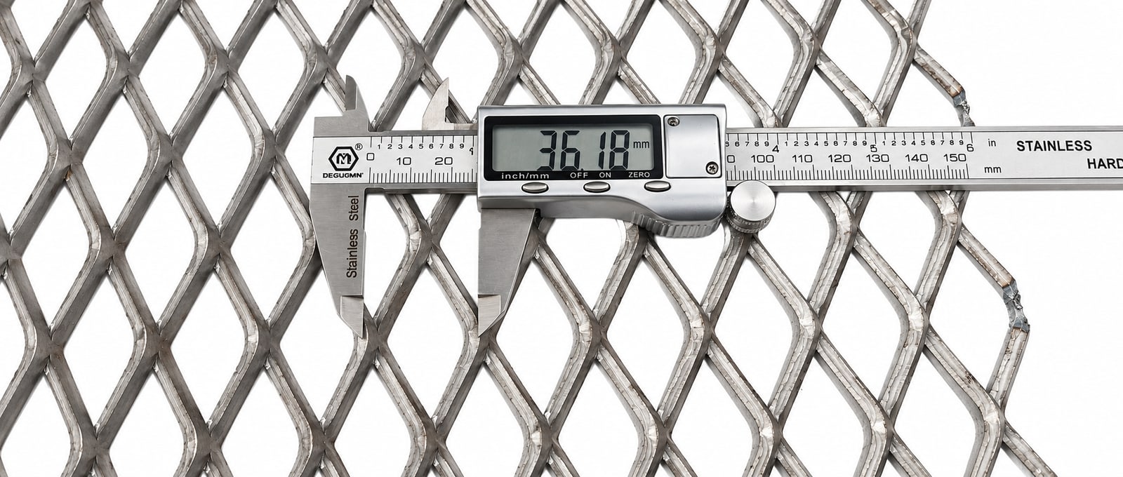 Digital caliper measuring the diamond opening of a raised expanded metal sheet