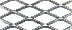 Close-up of raised stainless steel expanded metal strands and diamond openings