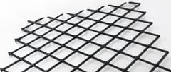 Black raised expanded metal sheet with large diamond openings on a white background