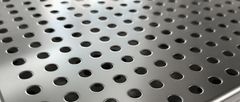 Close-up of perforated metal sheet with round holes