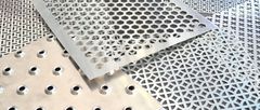 Perforated metal sheet samples with hexagonal, round and decorative hole patterns
