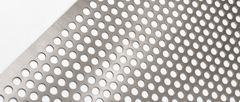 Close-up of stainless steel perforated sheet with staggered round holes