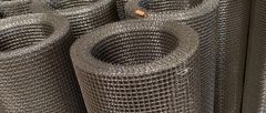 Stainless steel crimped wire mesh rolls showing woven square openings