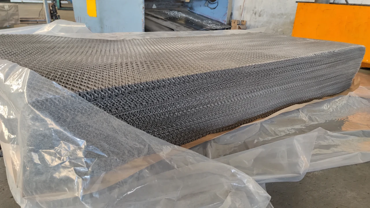 Stacked expanded metal sheets with protective plastic film prepared for packaging